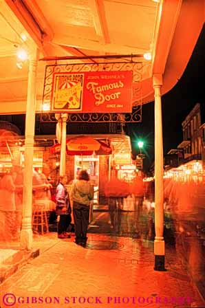 Stock Photo #8541: keywords -  bourbon bright building buildings dark destination dusk evening french lighting lights louisiana new night orleans people quarter recreation social street streets travel usa vacation vert