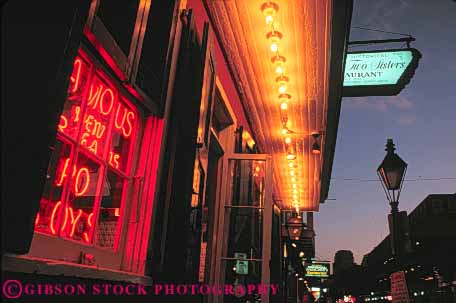 Stock Photo #8542: keywords -  bourbon bright building buildings dark destination dusk evening french horz lighting lights louisiana new night orleans people quarter recreation sign signs social street streets travel usa vacation