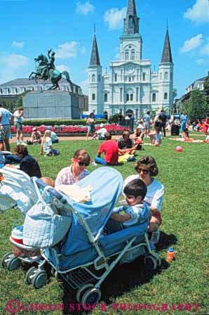 Stock Photo #8557: keywords -  axes baby cathedral child children destination grass jackson lawn louis louisiana mother mothers new orleans outdoors outside parent parents park people picnic recreation rel relax relaxed relaxing square st stroller summer sunny tourist tourists travel travelers usa vacation vert warm