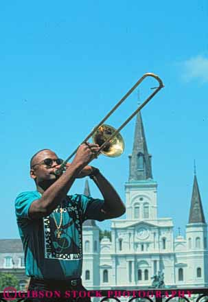 Stock Photo #8565: keywords -  african american black brass destination ethnic horn instrument instruments jazz louisiana male man minority music musical musician musicians new orleans outdoors outside perfo perform performer performers performing recreation released rmance show sound travel trombone usa vacation vert wind