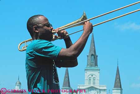 Stock Photo #8566: keywords -  african american black brass destination ethnic horn horz instrument instruments jazz louisiana male man minority music musical musician musicians new orleans outdoors outside perform performance performer performers performing recreation released show sound travel trombone usa vacation wind