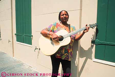 Stock Photo #8567: keywords -  african alone american black destination ethnic guitar horz instrument instruments jazz louisiana music musical musician new orleans perform performance performer performers performing recreation released show sound street string travel usa vacation woman