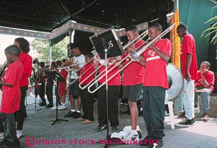 Stock Photo #8571: keywords -  african american black boy boys brass child children class coordinate coordinated coordinating costume costumes destination display elementary ethnic festival group horz instrument instruments jazz louisiana minority music musical musician new orleans perform performance performer performers performing recreation red rehearse school shirt show sound tee travel trombone trombones uniform unison unity usa vacation wind youth
