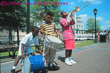 Stock Photo #8572: keywords -  african american black boy boys brass child children class coordinate coordinated coordinating destination display drum drummers drums elementary ethnic festival group horz instrument instruments jazz louisiana minority music musical musician new orleans perform performance performer performers performing recreation rehearse school show sound travel trombone trombones unison unity usa vacation wind youth