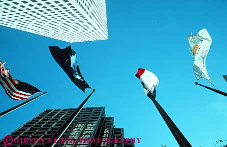 Stock Photo #8596: keywords -  between building buildings downtown flag flags high horz louisiana new office orleans poles rise sky up upward urban view