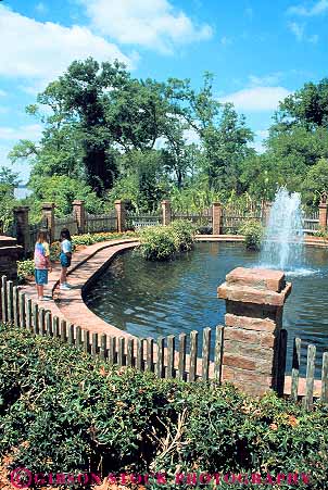 Stock Photo #13611: keywords -  brick design estate estates fence fountain fountains garden gardens girls historic history iberia landscape landscaped live louisiana new oak old plantation plantations site sites south southern style tradition traditional vert vintage wall water