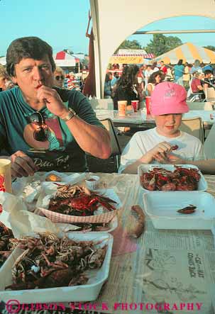 Stock Photo #13615: keywords -  activities activity annual boy child crawfish crayfish eat eating eats event events fair fairs father festival festivals food fun gather gathering louisiana madness man meal mudbug outdoor outside parent parents people play playing plays shreveport single sit sitting social son south southern summer table vert