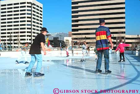 Stock Photo #9668: keywords - balance balanced balancing boy boys center child children city exercise exercising freeze freezing froze frozen fun gallivan gender girl girls glide gliding group groups horz ice icy lake mixed people play playing recreation rink rinks salt skate skater skates skating slide sliding slippery sport sports utah winter youth