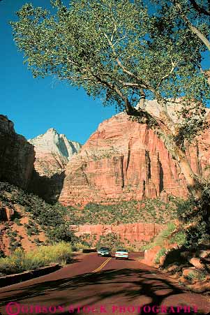 Stock Photo #12005: keywords -  canyon canyons car cars ecology environment habitat landscape landscapes mountains national park parks preserve public red road roads rock sandstone scenery scenic street streets through traffic utah vert zion