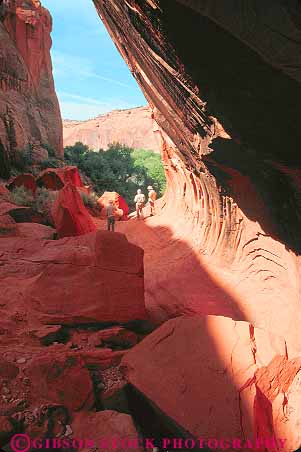 Stock Photo #12020: keywords -  area canyon canyons cliff deep erode eroded eroding erosion escalante formation geologic geological geology glen hike hiker hikers hiking in narrow national park parks people recreation ringtail river rock rocks sandstone slot southwest utah vert west western