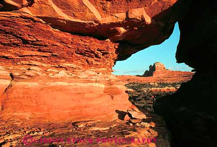 Stock Photo #13648: keywords -  canyonlands exposure formation formations gap geologic geological geology hole holes horz landscape landscapes national natural nature opening park parks public red redrock rock rocks sandstone scenery scenic sedimentary slickrock slot slots tunnel tunnels utah view