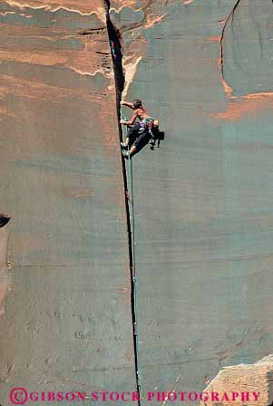 Stock Photo #13650: keywords -  alone brave canyonlands cliff cliffs climb climber climbers climbing climbs danger dangerous dangers exposure face faces fearless formation formations geologic geological geology landscape landscapes national natural nature park parks people person privacy private public recreation red redrock risk risking risks risky rock sandstone scenery scenic sedimentary single slickrock solitary solitude sport sports steep utah vert wall walls