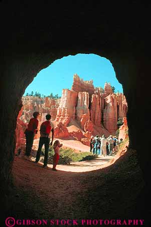 Stock Photo #12008: keywords - bryce canyon canyons cave caves circle circular ecology environment erode eroded eroding erosion family habitat hike hiker hikers hiking in landscape landscapes mountains national open opening park parks people preserve public red rock rocks round sandstone scenery scenic trail trails tunnel tunnels utah vert