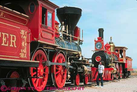 Stock Photo #13658: keywords -  american clean colorful duplicate duplicated engine engines equipment golden hardware heavy historic history horz identical locomotives national old painted park people person piece pieces pretty promontory public railroad railroads released replica replicas replicate replicated shiny site sites spike steam train trains transcontinental utah vintage woman