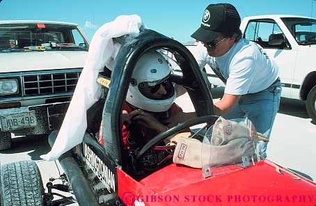 Stock Photo #13666: keywords -  aerodynamic aerodynamics auto automobile autos bonneville car cars colorful compete competing competition contest design dragster dragsters driver engineered engineering equipment fast flat flats helmet helmets horz hotrod hotrods lakebed preparations prepare prepared preparing race racecar racer racers races racing rollbar rollbars safety salt shiny sleek smooth speed speedway utah vehicle vehicles