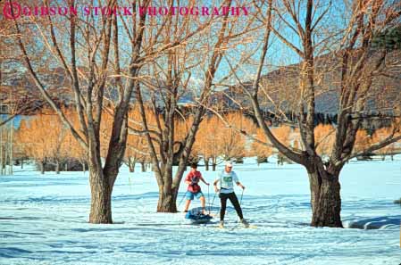 Stock Photo #9693: keywords -  aerobic aerobics area areas child chilly city cold country couple cross destination destinations exercise exercising families family horz in nordic park pull recreation resort resorts season ski sled snow sport sports travel utah winter workout