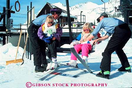 Stock Photo #13918: keywords -  alta area assist assistance assisting assists attendants chair chairs child children cold downhill girl girls help helped helper helpers helping helps horz kid kids lift lifting lifts mountain mountains onto outdoor outside recreation resort resorts rocky safety season seat seated sit sits sitting ski skier skiers skiing skis snow sport sports trip utah vacation wasatch winter youth