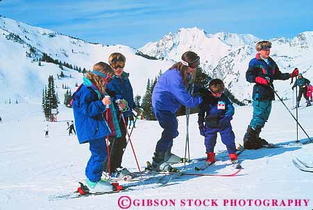 Stock Photo #13920: keywords -  alta area child children cold downhill families family group groups horz mother mountain mountains outdoor outside parent parents pose posed poses posing recreation released resort resorts rocky season ski skier skiers skiing skis snow sport sports together trip utah vacation wasatch winter