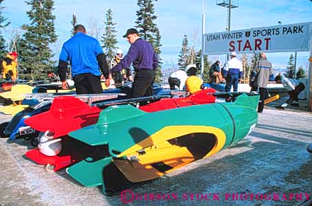 Stock Photo #9723: keywords -  aerodynamic area bobsled bobsledding bobsleds chilly city cold colorful downhill fast freeze freezing froze frozen horz ice icy park push pushing race racer racers racing run season shape sled sledding sleds slide sliding slippery speed sport sports staging team utah winter