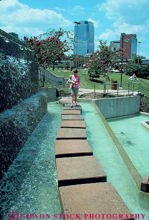Stock Photo #13956: keywords -  arkansas babies bay fountain fountains in little mother mothers outdoor outside park parks path public recreation released riverfront rock stepping stones summer trail vert walk walking water with