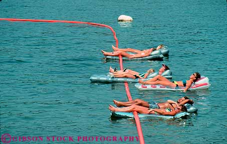 Stock Photo #13985: keywords -  air arkansas beaver calm float floater floaters floating floats freshwater group groups horz lake lakes leisure mattress people quiet relax relaxes relaxing summer swim swimming vacation water