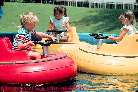 Stock Photo #11308: keywords - amusement boat boats boy boys bump bumper bumpers bumps child children colorful drive driving girl girls horz in kids libertyland memphis park steer steering steers tennessee youth
