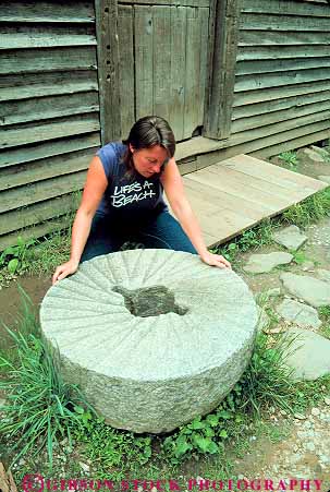 Stock Photo #13996: keywords - appalachia appalachian carolina circle circular great grind grinding grinds heavy heritage historic looks mill milling mills mingus mountain mountains national north old park parks public released round smoky stone stones tool tradition traditional vert wheel woman women