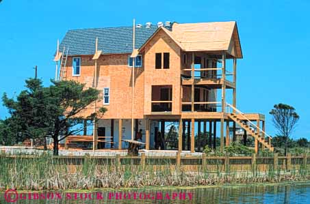 Stock Photo #9543: keywords -  banks beach beaches cape carolina coast coastal construction destination develop development hatteras home homes horz house march new north outer plywood residential resort resorts seashore shore shoreline stilts summer travel vacation wetland wetlands wood