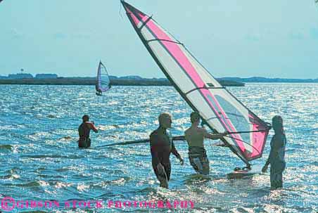Stock Photo #9551: keywords - banks beach beaches board cape carolina coast coastal destination hatteras head horz nags north ocean outer people recreation resort resorts sail sailing sea seashore shore shoreline silhouette silhouettes sport sports summer surf surfing travel vacation wind windsurfing
