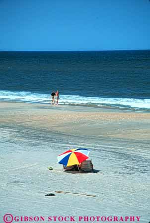 Stock Photo #9561: keywords - alone banks beach beaches cape carolina coast coastal couple destination hatteras isolate isolated north ocean open outer people privacy private quiet resort resorts sand sea seashore shore shoreline solitary solitude space summer travel umbrella vacation vert