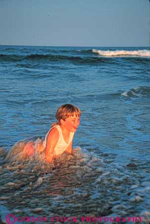 Stock Photo #9562: keywords -  banks beach beaches cape carolina child children coast coastal destination fun girl girls happy hatteras in laugh laughing north ocean outer play plays released resort resorts sand sea seashore shore shoreline smile smiling summer surf travel vacation vert water wet