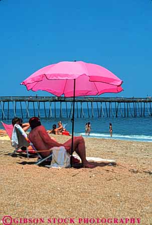 Stock Photo #9564: keywords - banks beach beaches cape carolina coast coastal destination family hatteras north ocean outer pink play relax relaxed relaxing resort resorts sand sea seashore shade shore shoreline summer travel umbrella umbrellas vacation vert warm