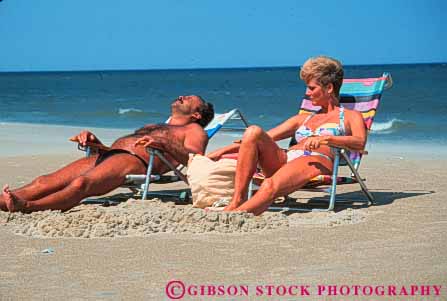 Stock Photo #9567: keywords -  banks bathing beach beaches cape carolina coast coastal couple destination hatteras horz husband man north ocean outer people relax relaxed relaxes relaxing released resort resorts sand sea seashore share shore shoreline suit summer sunbath sunbathing sunny sunshine together travel vacation warm wife woman
