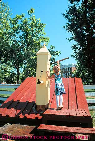 Stock Photo #14011: keywords -  architecture building buildings carolina child children communities community design girl girls handle historic history living museums north old pulling pump pumps reconstructed reconstruction released restored salem style summer vert village villages vintage water