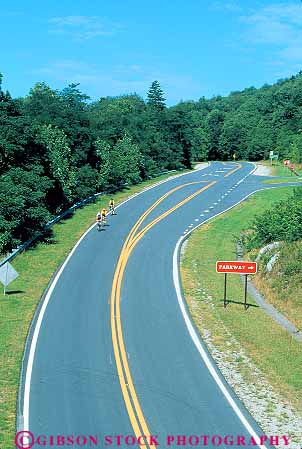Stock Photo #14038: keywords - appalachia appalachian bicycle bicycles bicycling bicyclist bicyclists blue byway carolina countryside curve curves curving great landscape landscapes mountain mountains national north park parks parkway pavement peddle peddling people public recreation ride rider riders rides ridge riding road route routes rural scenery scenic smoky sport spring street summer vert