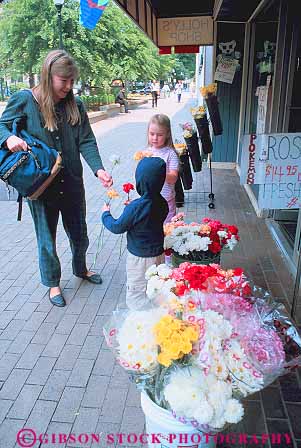 Stock Photo #14059: keywords -  buy buyer buying carolina child children choose chooses choosing customer customers downtown flower flowers for mother north parent parents pick picking picks raleigh select selecting selects shop shopper shoppers shopping single together vert with