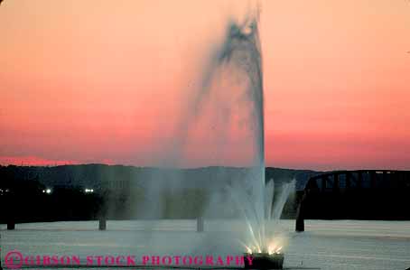 Stock Photo #14127: keywords -  cities city dark dusk evening fountain fountains horz kentucky louisville ohio orange river rivers skyward spray sprays squirt squirting squirts summer sunset sunsets up upward upwards water