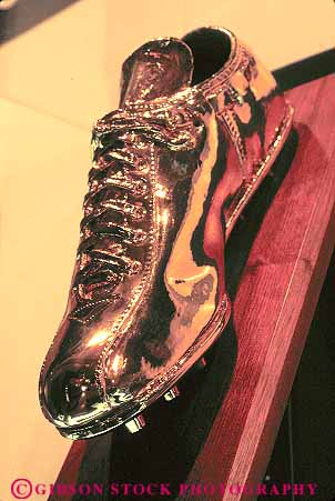 Stock Photo #14155: keywords - acknowledge acknowledges bronze bronzed canton commemorate commemorates commemorating display displaying displays distinguish distinguished exhibit exhibiting exhibits fame football hall halls of ohio preserve preserved pro shoe shoes sport sports stars vert
