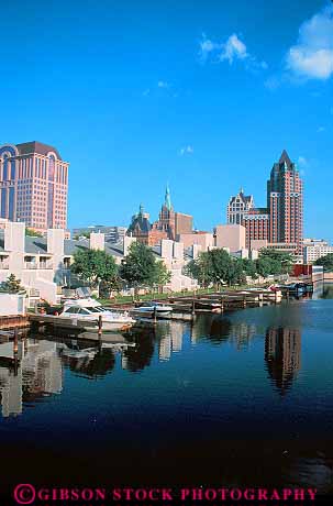 Stock Photo #11327: keywords -  buildings cities city cityscape cityscapes clean downtown milwaukee river rivers skyline skylines urban vert water waterway wisconsin