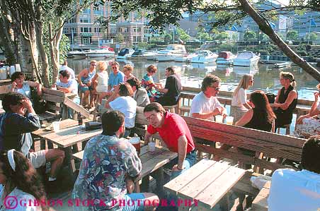 Stock Photo #11341: keywords -  cafe cafes dine dining downtown group harp horz milwaukee outdoor outside people relax relaxed relaxing restaurant river rivers social summer umbrella umbrellas urban wisconsin