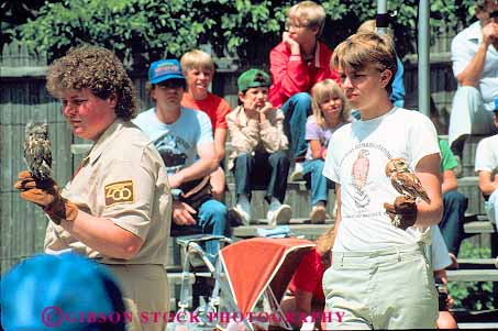 Stock Photo #11349: keywords -  bird birds captive captivity display employee employees exhibit handler handlers hold horz job jobs milwaukee owl owls present program touch wildlife wisconsin work worker workers working works zoo