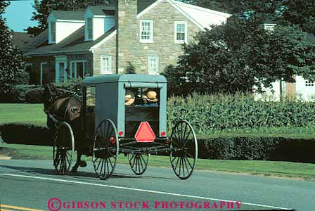 Stock Photo #14198: keywords -  amish attraction black carriage carriages cart carts country drawn dutch heritage horse horses horz lancaster old pennsylvania street style tourist tradition traditional transportation traveler wagon wagons