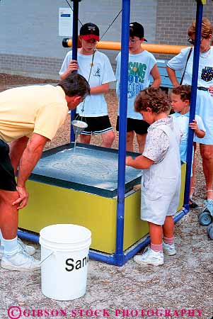 Stock Photo #11180: keywords -  child children display displays exhibit exhibits experiment families family franklin hands institute interactive learn learning museum museums outdoor outside parent park participate participating pennsylvania people philadelphia sand science vert