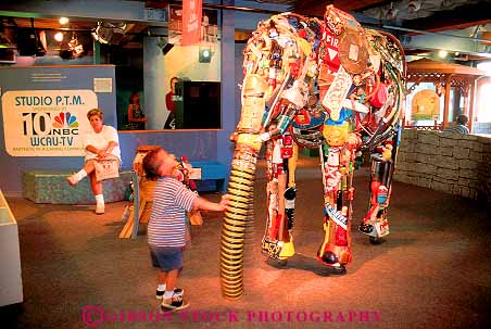 Stock Photo #11182: keywords - boy child children display displays elephant exhibit exhibits horz learn learning made material materials museum museums of pennsylvania philadelphia please recycle recycled recycling see touch touching