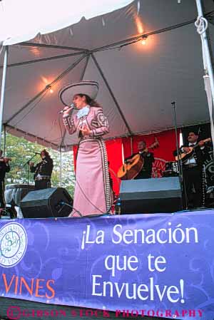Stock Photo #8986: keywords -  activity annual azucena chicago ethnic event events fair fairs female festival festivals hispanic illinois language leisure mexican music musical musician outdoor outside people perform performance performer performing performs public recreation show sign sing singer singing sings soloist stage vert viva vocalist woman