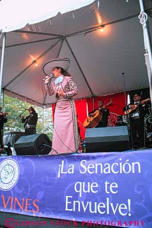 Stock Photo #8986: keywords - activity annual azucena chicago ethnic event events fair fairs female festival festivals hispanic illinois language leisure mexican music musical musician outdoor outside people perform performance performer performing performs public recreation show sign sing singer singing sings soloist stage vert viva vocalist woman