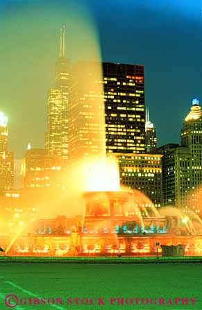 Stock Photo #9029: keywords -  bright buckingham chicago colorful dark display downtown dusk evening fountain illinois illuminate illuminated illuminates lighting lights night skyline skylines spray urban vert water