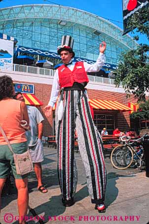 Stock Photo #9032: keywords -  activities activity amusement attraction chicago fun game games illinois man navy park pier play recreation ride rides stilts summer tall tourist travel vert