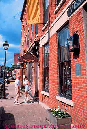 Stock Photo #18976: keywords -  architecture brick building buildings business center commercial couple couples design district downtown galena illinois old people person shoppers shopping shops store storefront stores street style town towns tradition traditional vert vintage