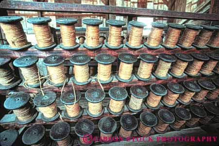 Stock Photo #9936: keywords -  american attraction boat boats coast coastal coil coiled connecticut cord cordage cylinder cylindrical england equipment harbor harbors historic history horz marina marinas mystic new ocean of old organize organized pattern patterns port rack repeat repeats repetition restored round rustic sail sailing sea seaport seashore serial ship ships shore shoreline site sites spool spools storage store string symmetrical symmetry tool tools tourist vintage